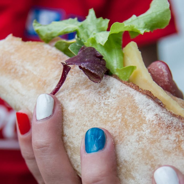 woman holding a sandwich